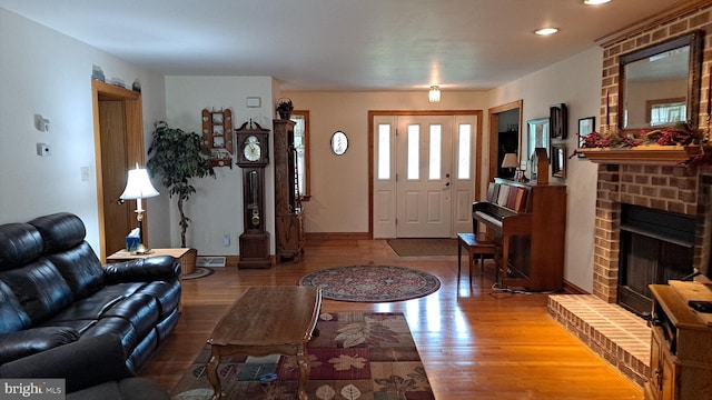 711 Tristan Trl, Chambersburg, PA 17202 - living room featuring light wood finished floors, baseboards, a fireplace, and recessed lighting