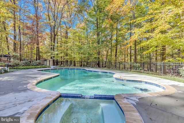 8150 Wolf Run Shoals Rd, Clifton, VA 20124 - view of pool with a pool with connected hot tub, a fenced backyard, a view of trees, and a patio area