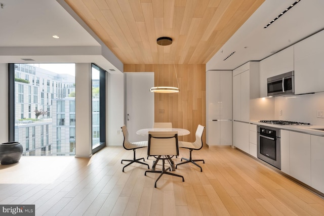 920 I St NW Unit 704, Washington, DC 20001 - kitchen with stainless steel appliances, modern cabinets, white cabinetry, wooden ceiling, and recessed lighting