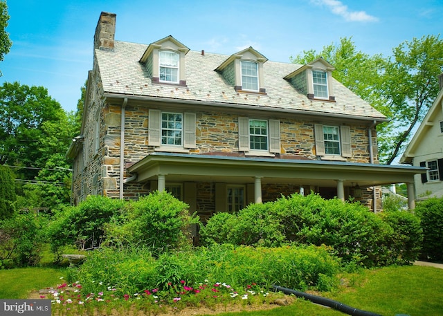 731 S Latches Ln, Merion Station, PA 19066 - view of front of home featuring a high end roof, stone siding, and a chimney