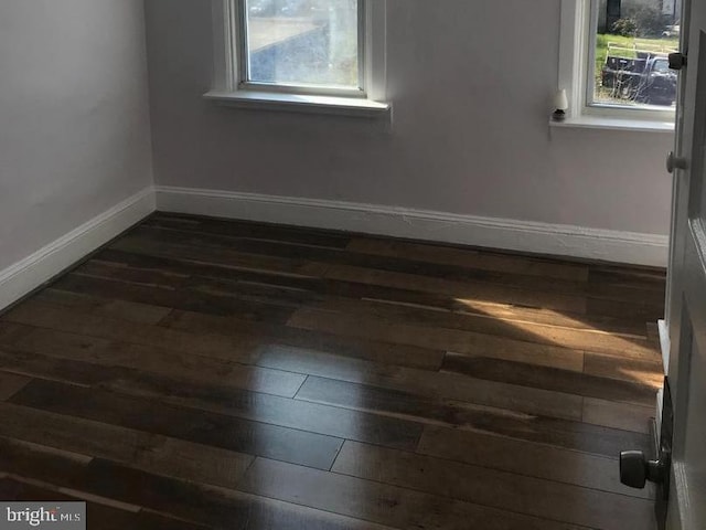 1522 Plum St, Baltimore City, MD 21226 - unfurnished room featuring dark wood-style flooring and baseboards