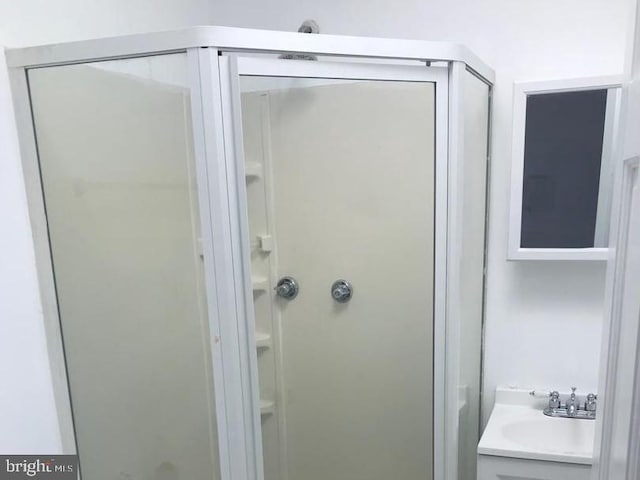 1522 Plum St, Baltimore City, MD 21226 - bathroom featuring a stall shower and vanity