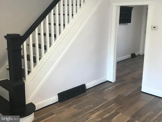 1522 Plum St, Baltimore City, MD 21226 - stairway with wood finished floors and baseboards