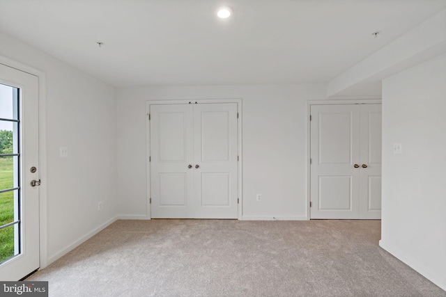 16 Angus Dr, Hanover, PA 17331 - unfurnished bedroom featuring light carpet, baseboards, and multiple closets