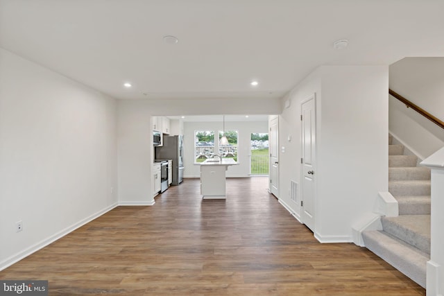16 Angus Dr, Hanover, PA 17331 - unfurnished living room featuring recessed lighting, stairway, wood finished floors, and baseboards