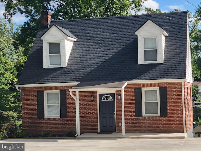 304 Maiden Choice Ln, Catonsville, MD 21228 - cape cod-style house with brick siding, a chimney, and a shingled roof