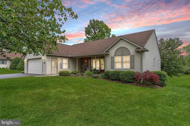 7 Brookside Cir, Myerstown, PA 17067 - ranch-style house with driveway, a front yard, a shingled roof, and a garage