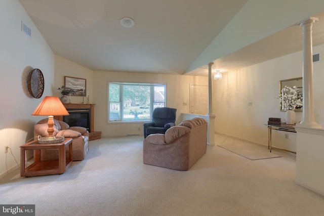 7 Brookside Cir, Myerstown, PA 17067 - living room with decorative columns, lofted ceiling, carpet, a glass covered fireplace, and baseboards
