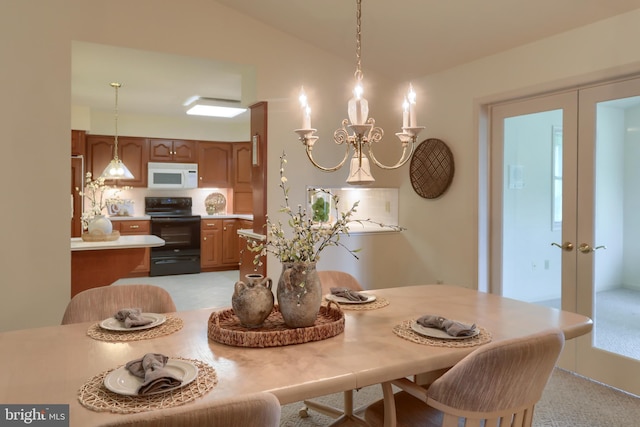 7 Brookside Cir, Myerstown, PA 17067 - dining space with french doors, vaulted ceiling, and a chandelier