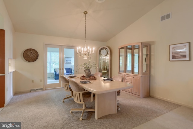 7 Brookside Cir, Myerstown, PA 17067 - dining area with light colored carpet, a chandelier, vaulted ceiling, and baseboards