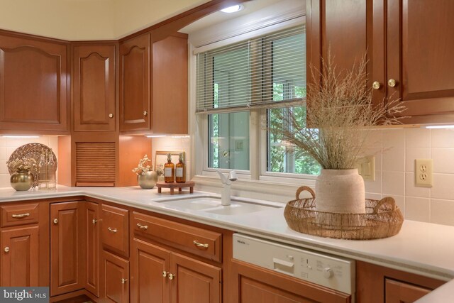 7 Brookside Cir, Myerstown, PA 17067 - kitchen featuring white dishwasher, light countertops, backsplash, and a sink