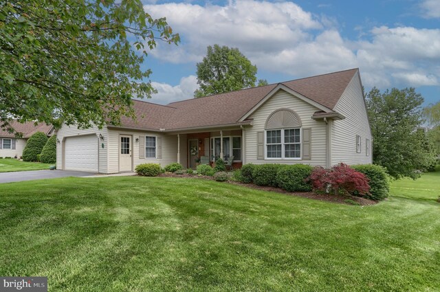 7 Brookside Cir, Myerstown, PA 17067 - ranch-style house with a front lawn, driveway, an attached garage, and a shingled roof