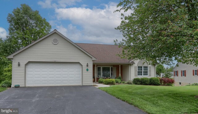 7 Brookside Cir, Myerstown, PA 17067 - ranch-style house featuring driveway, a garage, a front lawn, a shingled roof, and brick siding