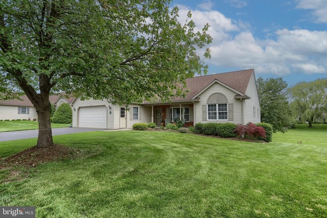 7 Brookside Cir, Myerstown, PA 17067 - ranch-style house featuring asphalt driveway, a front lawn, an attached garage, and roof with shingles