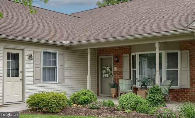 7 Brookside Cir, Myerstown, PA 17067 - property entrance featuring brick siding, a shingled roof, and a porch