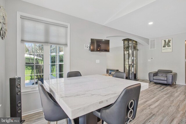 3270 Channel Ct, Huntingtown, MD 20639 - dining space featuring arched walkways, light wood finished floors, healthy amount of natural light, decorative columns, and recessed lighting