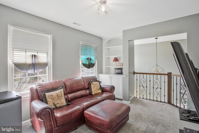 3270 Channel Ct, Huntingtown, MD 20639 - carpeted living room featuring built in shelves