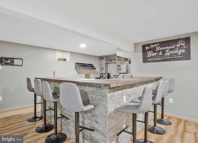 3270 Channel Ct, Huntingtown, MD 20639 - indoor wet bar featuring baseboards, wood finished floors, and freestanding refrigerator