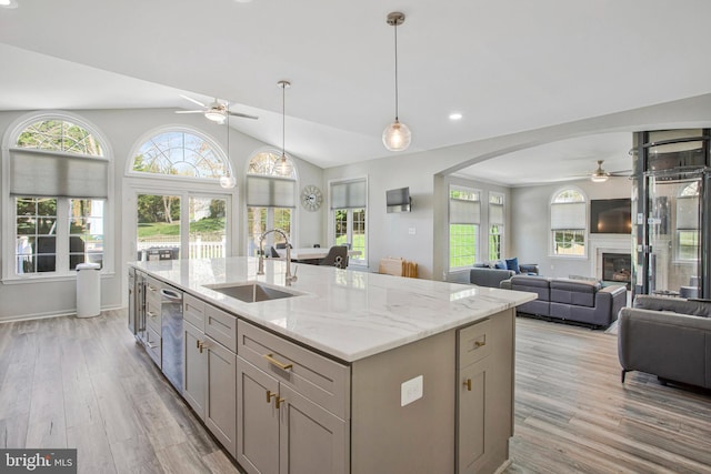 3270 Channel Ct, Huntingtown, MD 20639 - kitchen with a ceiling fan, a sink, gray cabinets, arched walkways, and light wood-style flooring