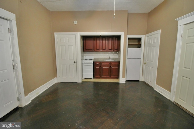 4621 N Broad St, Philadelphia, PA 19140 - kitchen with white appliances, a sink, light countertops, baseboards, and dark brown cabinets