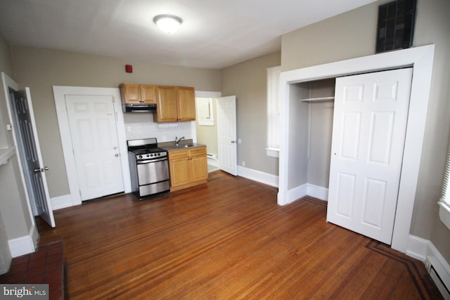 4621 N Broad St, Philadelphia, PA 19140 - kitchen with gas range, exhaust hood, dark wood-style flooring, baseboards, and a sink