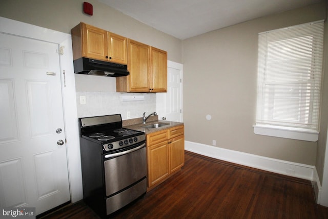 4621 N Broad St, Philadelphia, PA 19140 - kitchen featuring stainless steel electric range oven, under cabinet range hood, dark wood-type flooring, a sink, and baseboards
