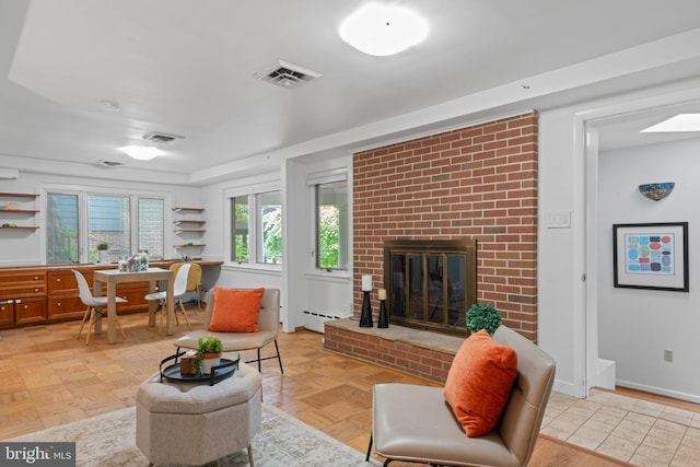1414 N Johnson St, Arlington, VA 22201 - living room featuring a fireplace, baseboard heating, and baseboards