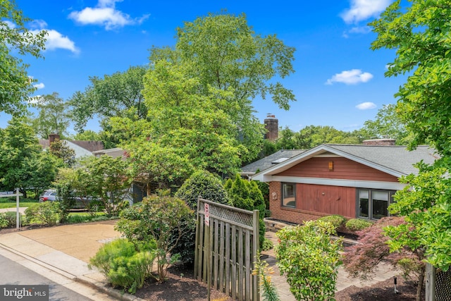 1414 N Johnson St, Arlington, VA 22201 - view of side of property with brick siding and a chimney