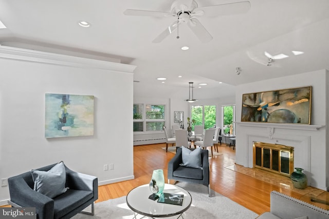 1414 N Johnson St, Arlington, VA 22201 - living area with a baseboard radiator, light wood-style floors, lofted ceiling, recessed lighting, and a ceiling fan