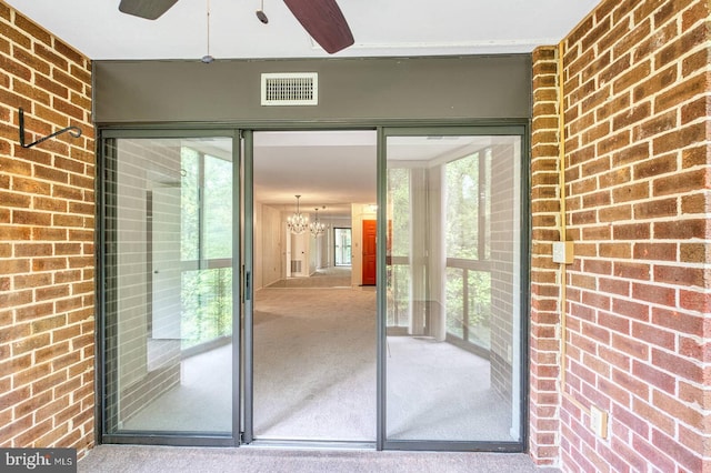 15115 Interlachen Dr Unit 3-920, Silver Spring, MD 20906 - view of exterior entry with brick siding and a ceiling fan