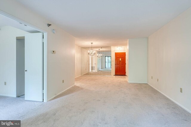 15115 Interlachen Dr Unit 3-920, Silver Spring, MD 20906 - unfurnished room featuring a chandelier, light carpet, and baseboards