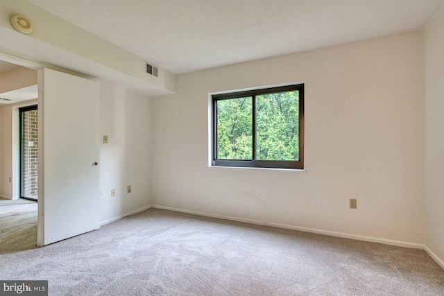 15115 Interlachen Dr Unit 3-920, Silver Spring, MD 20906 - carpeted spare room featuring baseboards, a textured ceiling, and a smoke detector