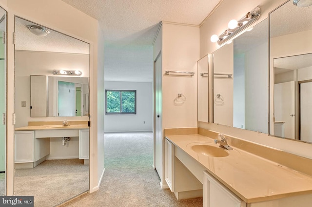 15115 Interlachen Dr Unit 3-920, Silver Spring, MD 20906 - bathroom with a sink, a textured ceiling, and baseboards