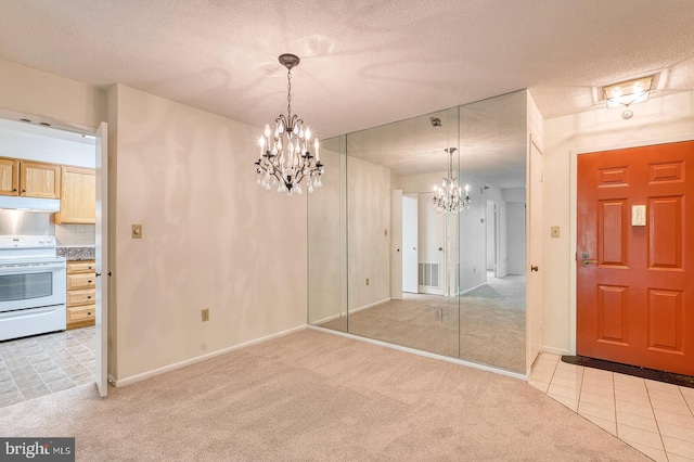 15115 Interlachen Dr Unit 3-920, Silver Spring, MD 20906 - unfurnished dining area with a chandelier, light colored carpet, baseboards, light tile patterned floors, and a textured ceiling