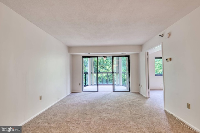 15115 Interlachen Dr Unit 3-920, Silver Spring, MD 20906 - spare room with carpet floors, a textured ceiling, and baseboards