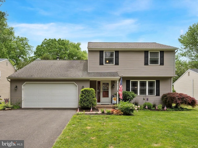 4811 Kings Rd, Doylestown, PA 18902 - view of front of house featuring an attached garage, asphalt driveway, and a front lawn