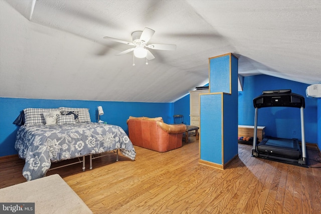 4811 Kings Rd, Doylestown, PA 18902 - bedroom with wood finished floors, baseboards, vaulted ceiling, ceiling fan, and a textured ceiling