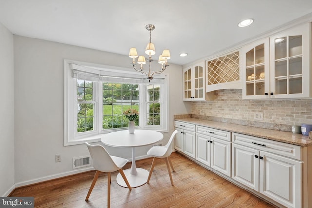 11340 Waples Mill Rd, Oakton, VA 22124 - dining room with baseboards, a chandelier, light wood finished floors, and recessed lighting