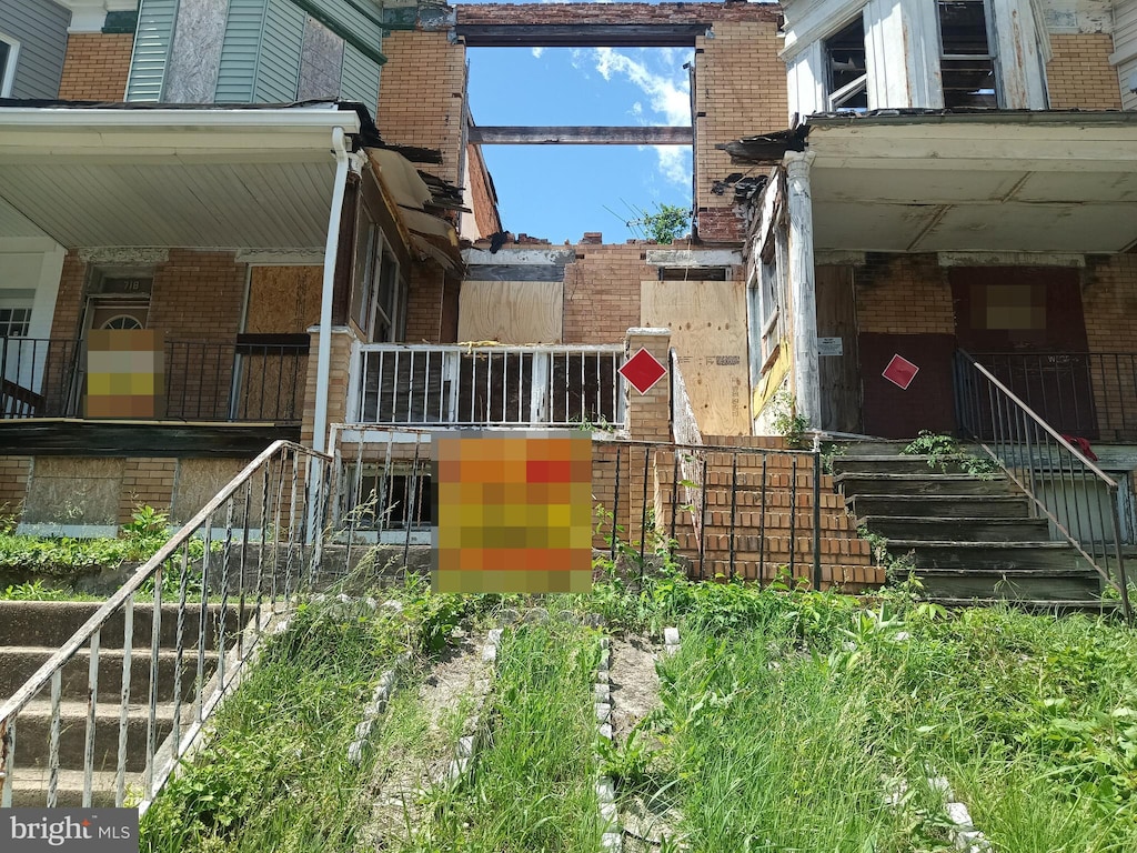 720 E 23rd St, Baltimore, MD 21218 - view of property exterior with brick siding and stairway