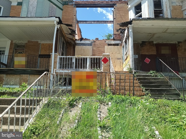 720 E 23rd St, Baltimore, MD 21218 - view of property exterior with brick siding and stairway