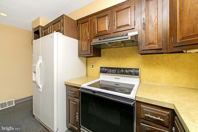 681 Dutton Cir, Springfield, PA 19064 - kitchen featuring electric range oven, under cabinet range hood, white refrigerator with ice dispenser, light countertops, and a textured ceiling
