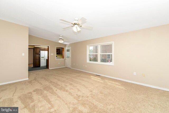 681 Dutton Cir, Springfield, PA 19064 - empty room featuring light carpet, a ceiling fan, baseboards, and vaulted ceiling