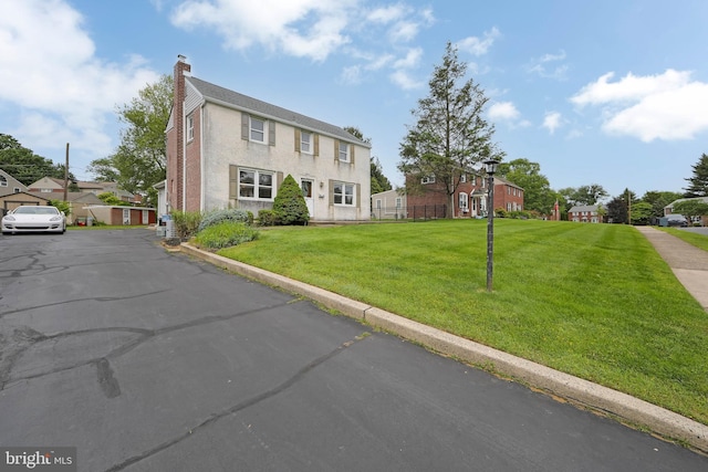 681 Dutton Cir, Springfield, PA 19064 - colonial home featuring a chimney and a residential view