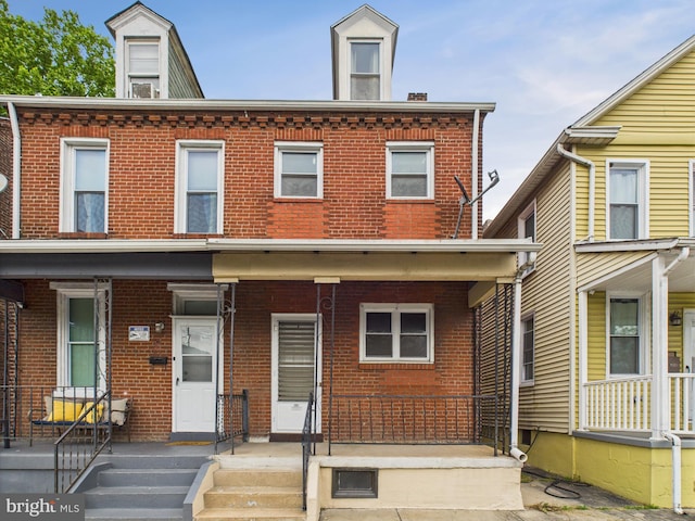 713 S Front St, Steelton, PA 17113 - view of property featuring a porch and brick siding