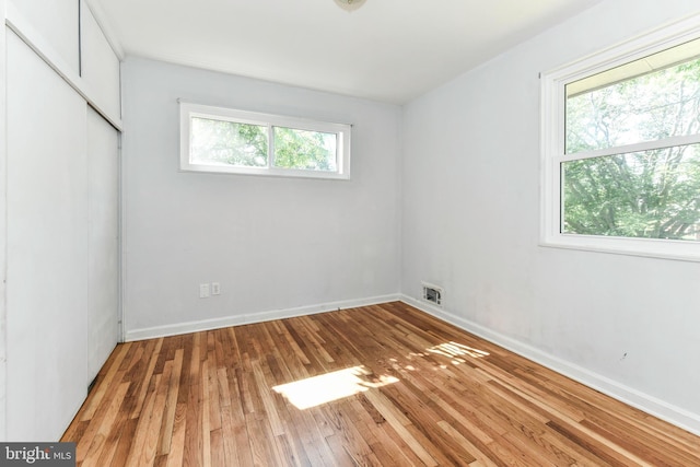6322 Phyllis Ln, Alexandria, VA 22312 - unfurnished bedroom with hardwood / wood-style floors, baseboards, and a closet