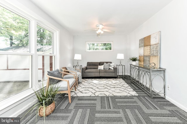 6322 Phyllis Ln, Alexandria, VA 22312 - living room with dark colored carpet, ceiling fan, and baseboards