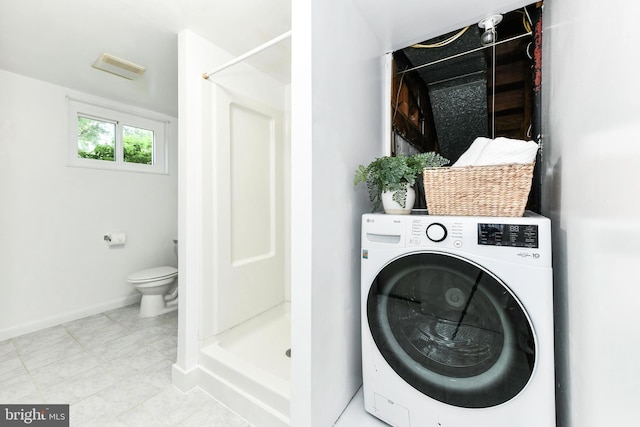 6322 Phyllis Ln, Alexandria, VA 22312 - washroom with washer / clothes dryer, baseboards, and tile patterned floors