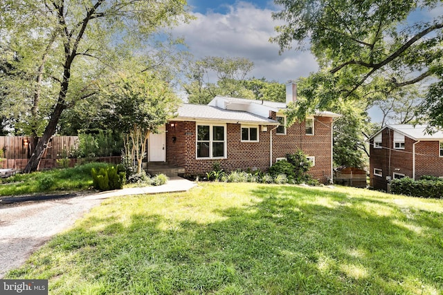 6322 Phyllis Ln, Alexandria, VA 22312 - view of front of home featuring brick siding and a chimney
