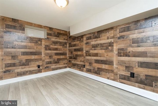 2306 Monticello Rd, Baltimore, MD 21216 - empty room featuring wood walls and wood finished floors