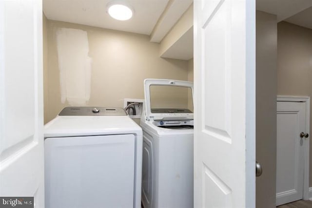 2306 Monticello Rd, Baltimore, MD 21216 - washroom with washing machine and clothes dryer